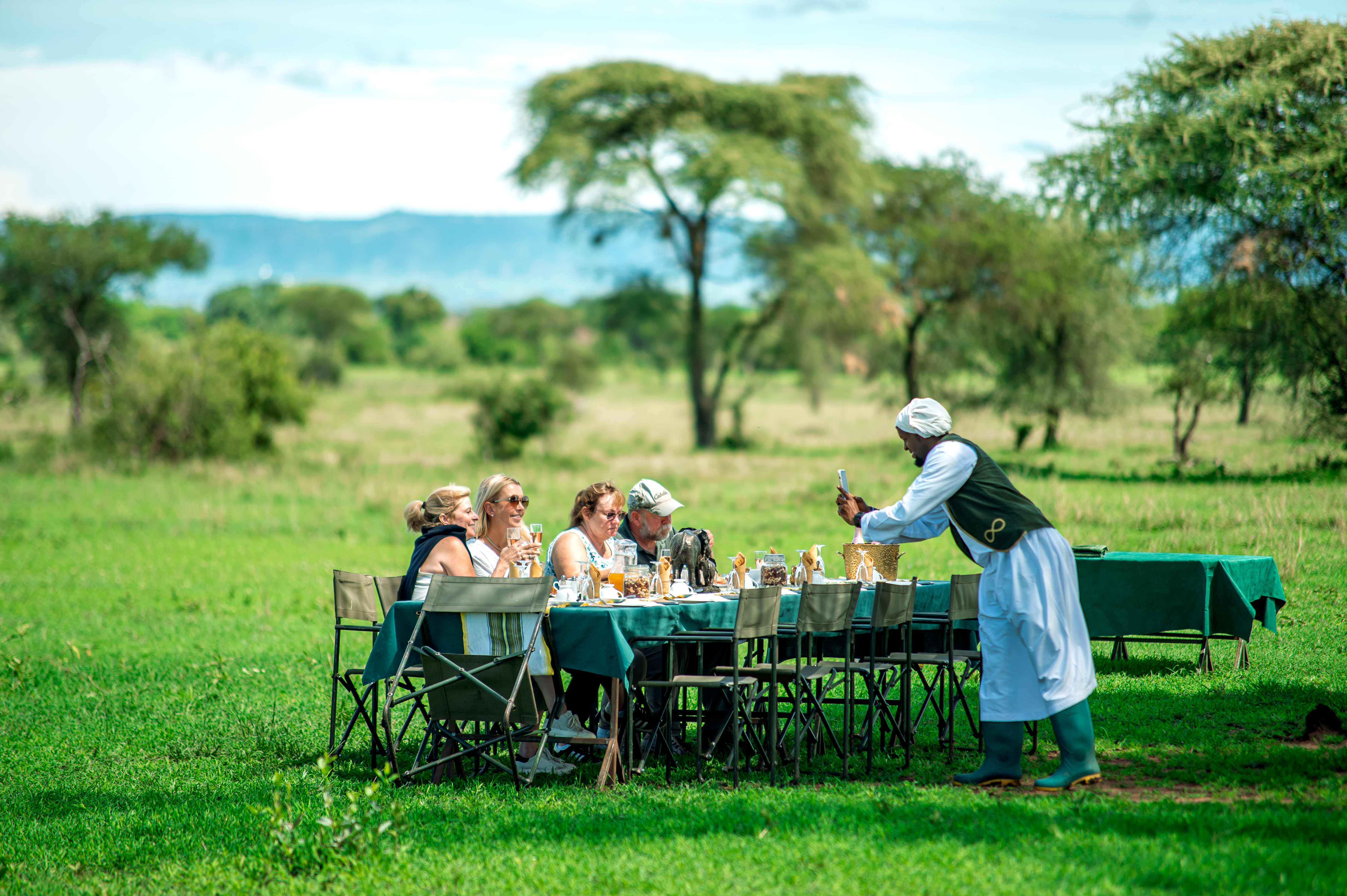 Guests enjoying a private dining experience on the grasslands
