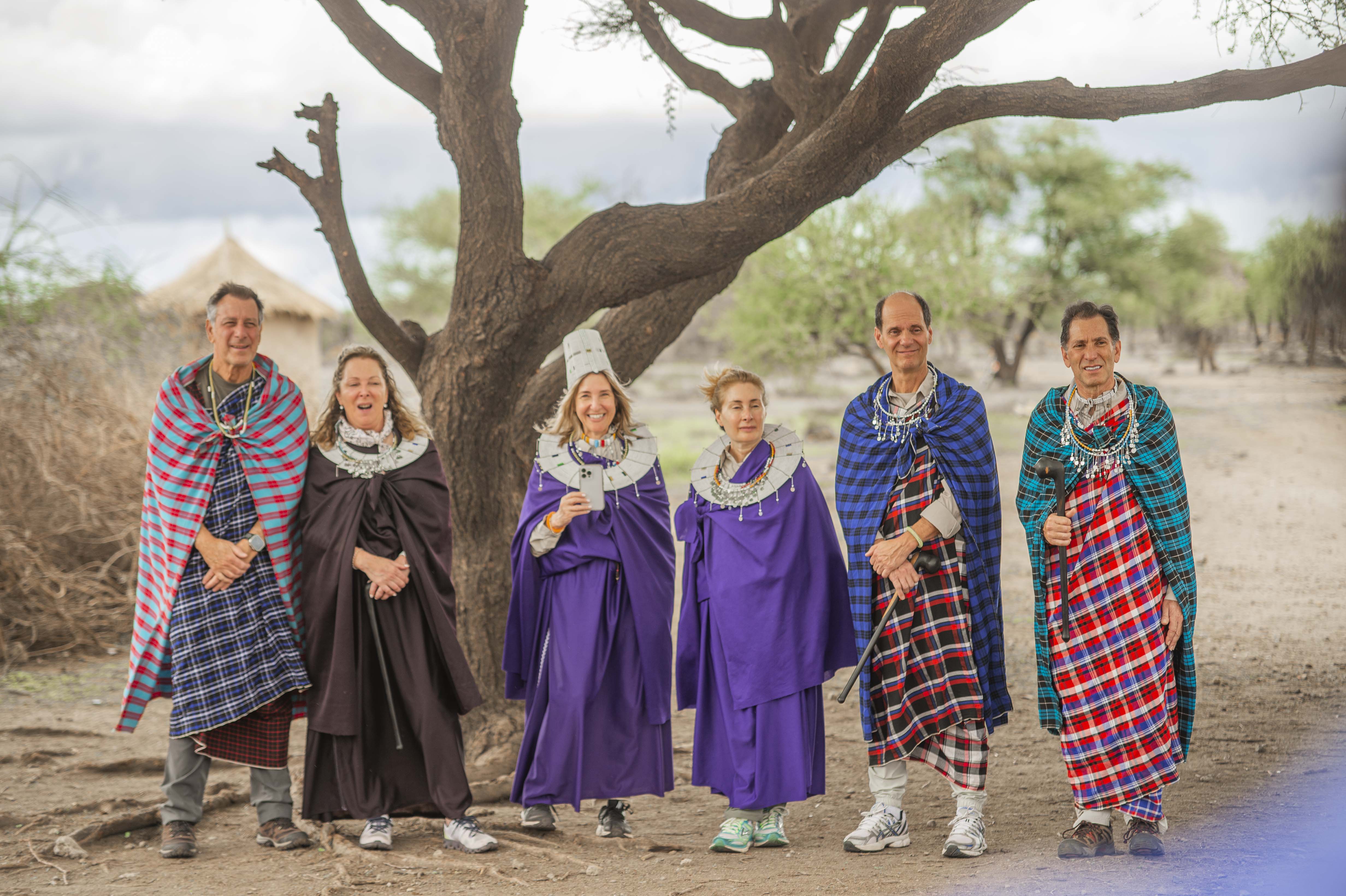 Guests wearing colourful Maasai clothing during a cultural visit