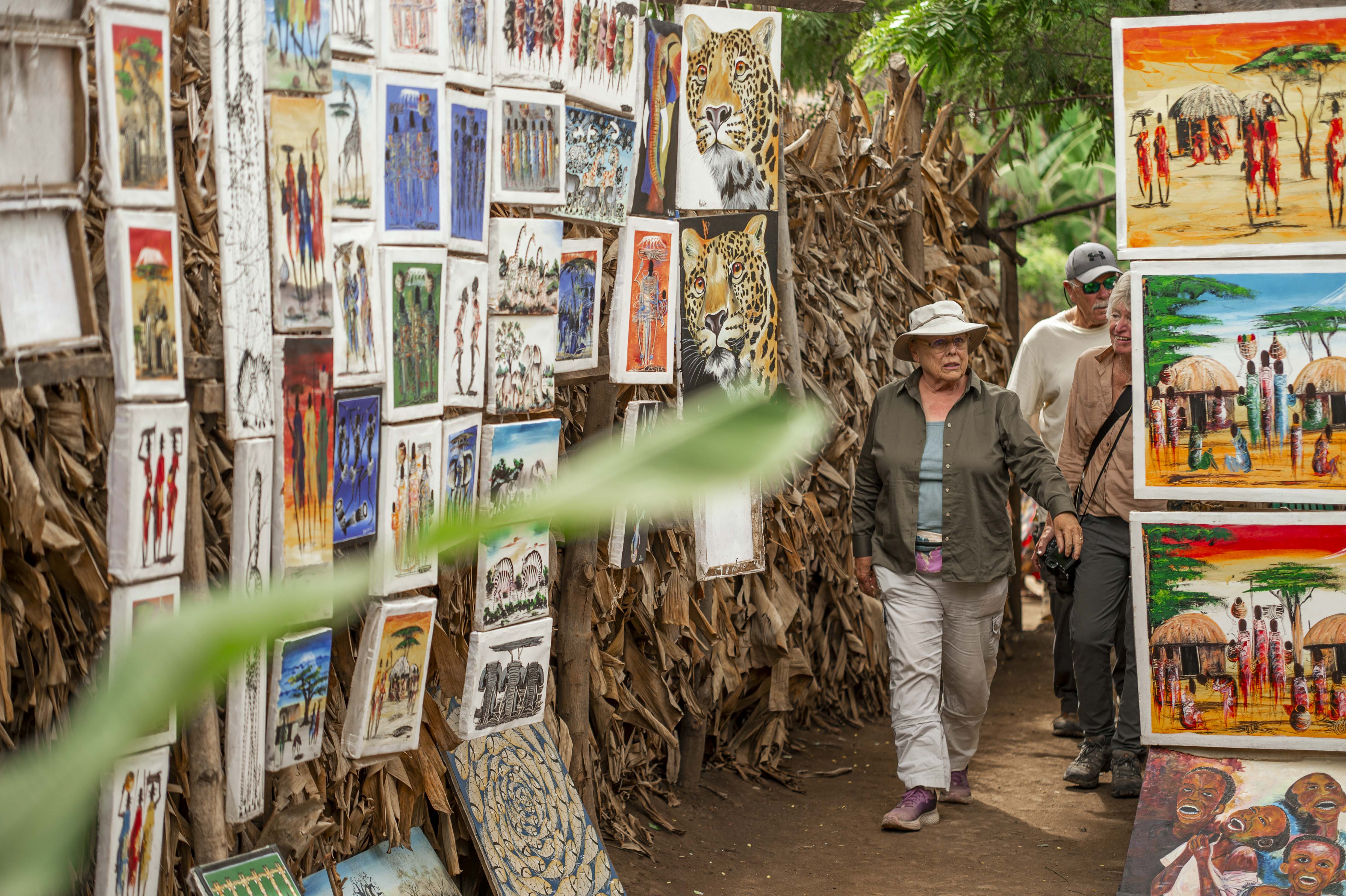 Guests exploring colourful local art in Tanzania
